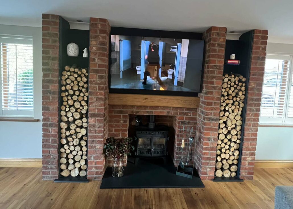 woodburning stove install with media wall reading and Glanyrafon
