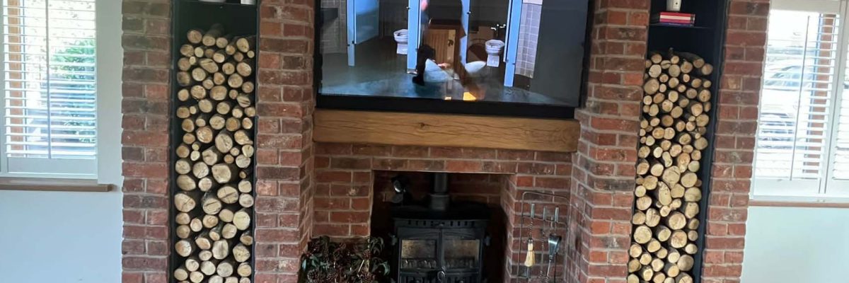 woodburning stove install with media wall reading and Glanyrafon